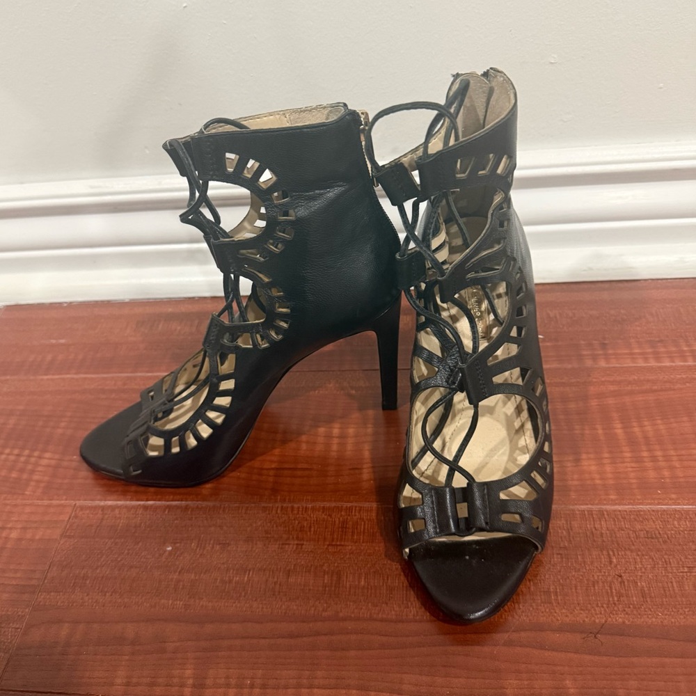 Elegant Black Cutout Heels
BCBG 
6 1/2